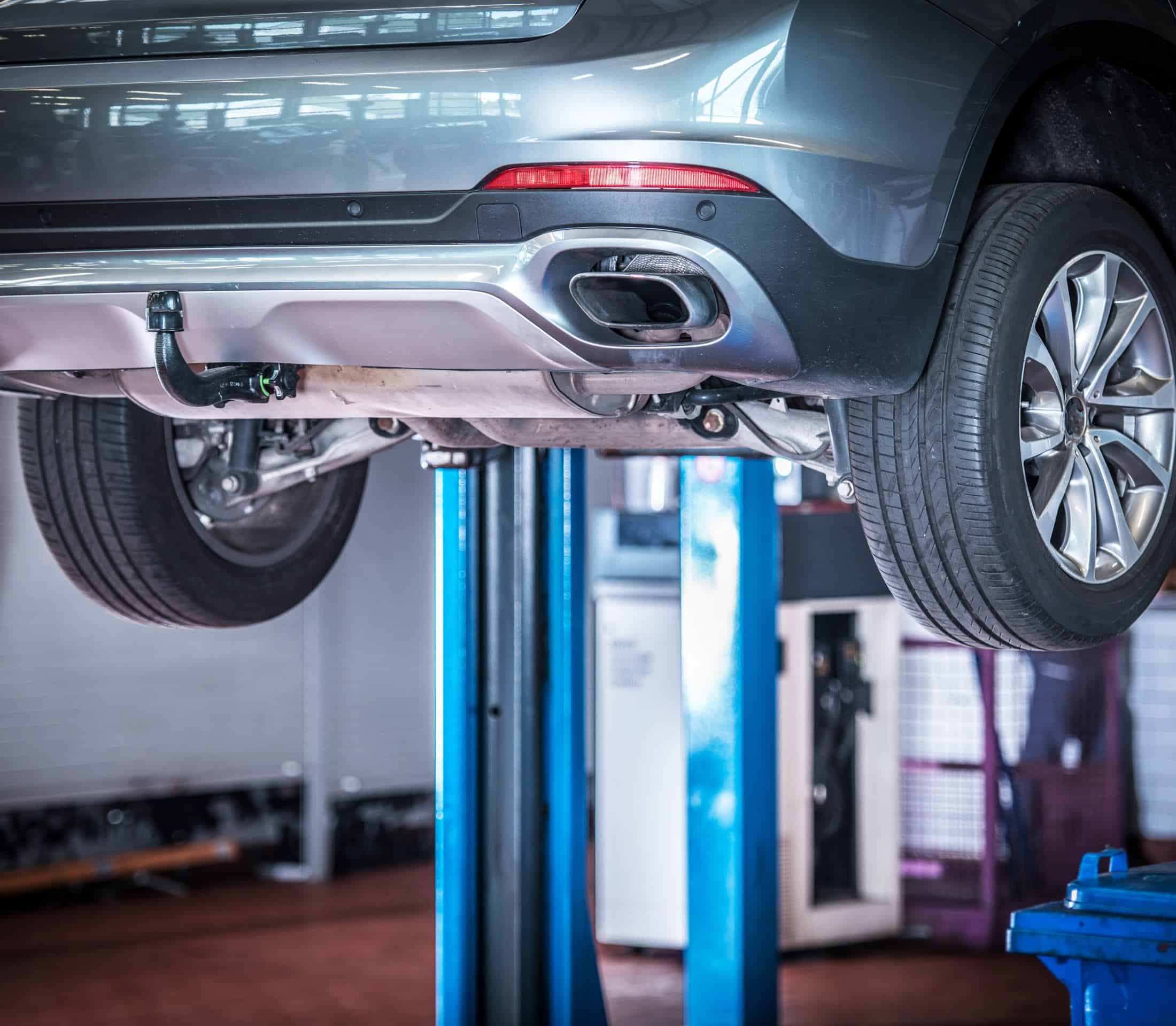 Under vehicle repair at Greens Garage Suffolk, automotive maintenance and servicing center.